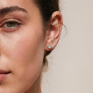 Yellow Gold 18k diamond bezel studs worn on model 