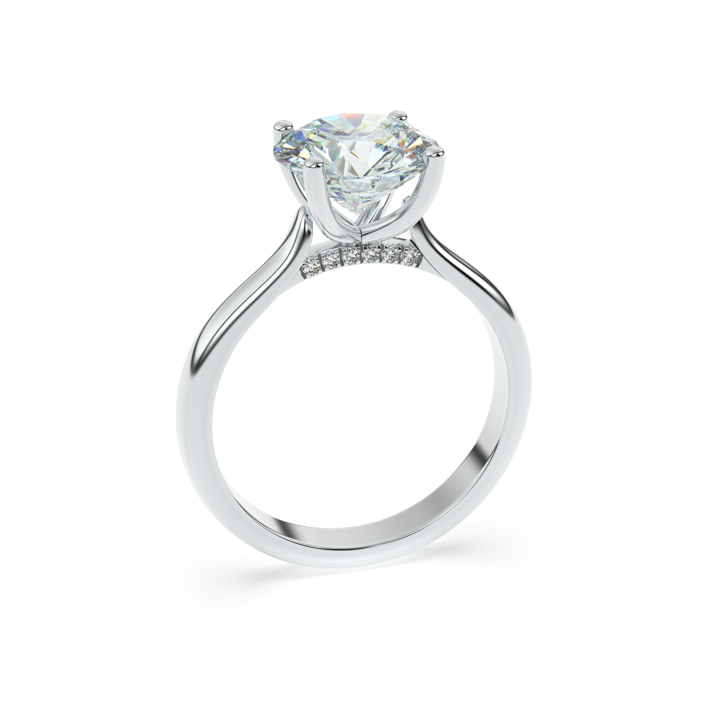 ÉLODIE solitaire diamond engagement ring in 18k white gold with hidden pavé