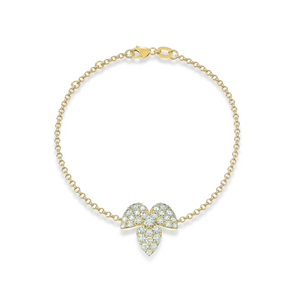 Close-up of GLACE bracelet in yellow gold with glacier-inspired centerpiece