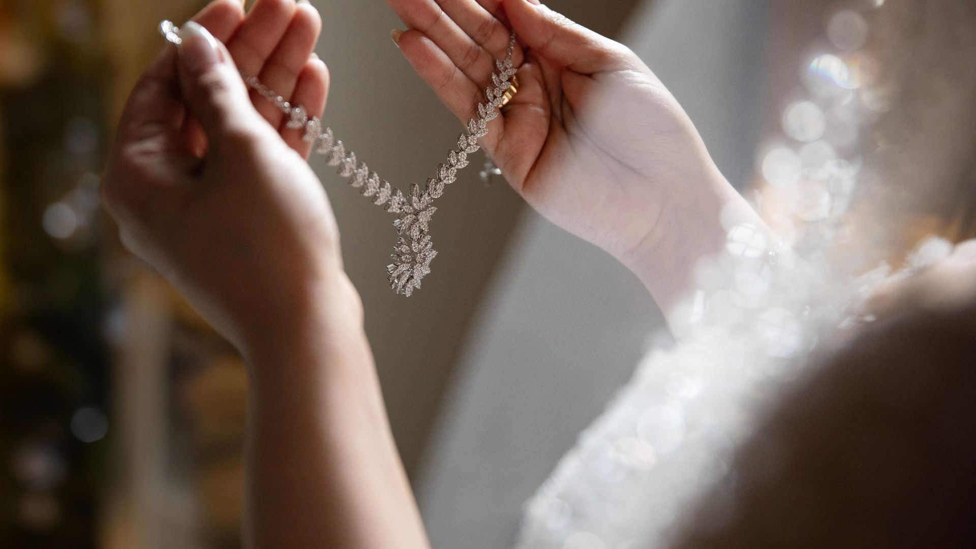 Heirloom diamond necklace held in hands – timeless natural diamond jewelry