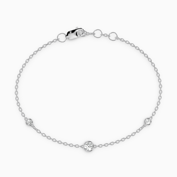 PURE diamond bracelet in white gold with bezel-set natural diamonds, delicate fine chain design for everyday wear.